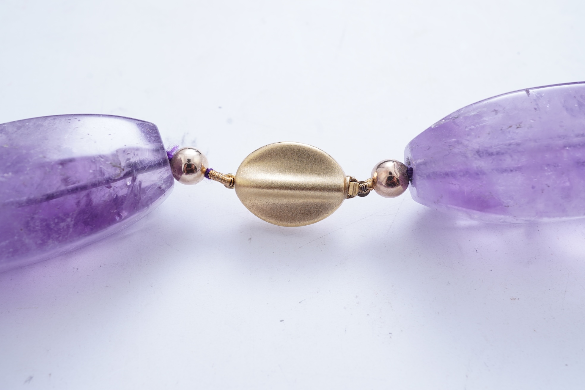 An amethyst and gold necklace